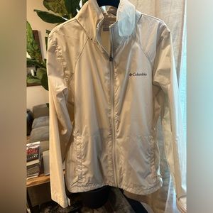 NEW. Never worn. Women’s Columbia rain jacket. Can unzip collar for hood.